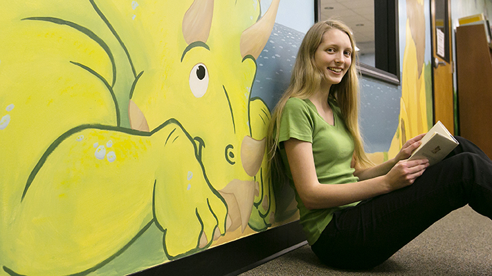 Lara Edwards spent more than 100 hours working on a mural for the children's library in Rolla. Photo by Sam O'Keefe.