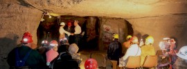 S&T alumni Genevieve (DuBois) Bodnar and Greg Sutton exchange vows in the Experimental Mine on Dec. 20, 2014.