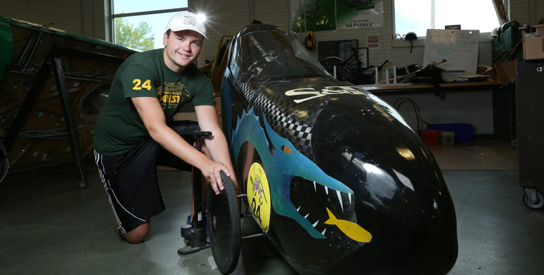 Lucas Parker poses with the Human Powered Vehicle Competition Team’s current vehicle, named “Leviathan,” which recently won the American Society of Mechanical Engineers 2015 Human Powered Vehicle Challenge East Coast Competition in Gainesville, Florida.