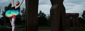 Kailea Tilden dances in front of the Millenium Arch on campus.