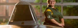 Letha Young, a lieutenant with the Missouri S&T police department and advisor to the university’s Solar Car Design Team, poses with the team’s car.